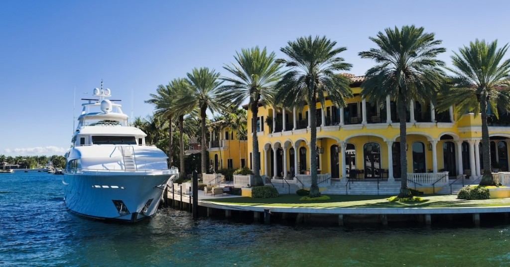 Florida Mediterranean mansion with private dock and yacht, prime real estate in Miami luxury market for smart investing
